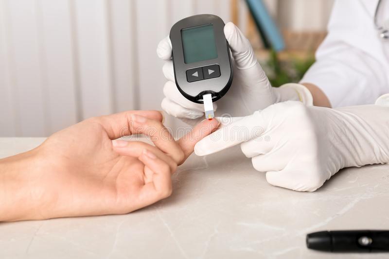 Doctor Checking Blood Sugar Level With Glucometer Stock ...